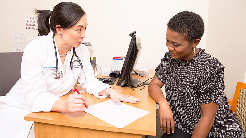 Doctor reviewing labs with patient Doctor reviewing labs with patient