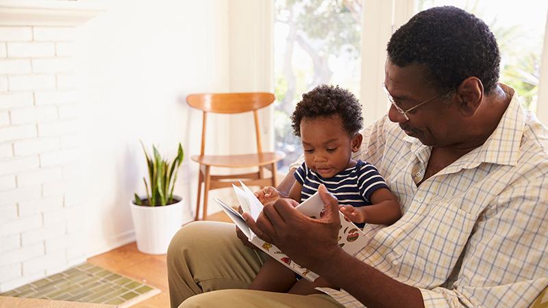 grandfather and grandson reading book grandfather and grandson reading book