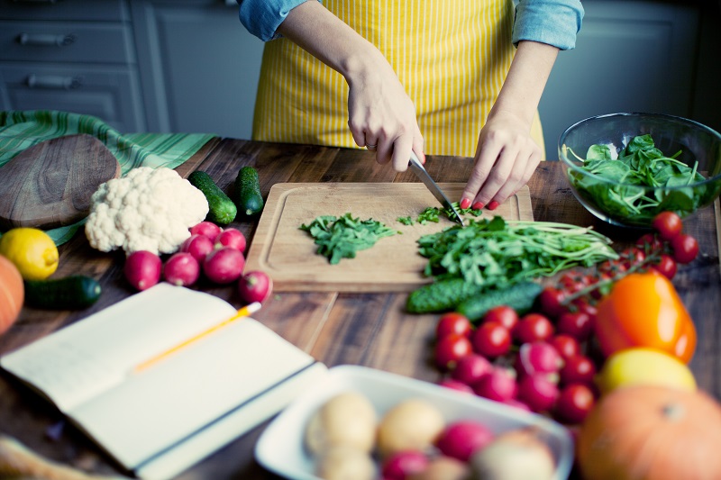 Woman chopping vegetables Woman chopping vegetables